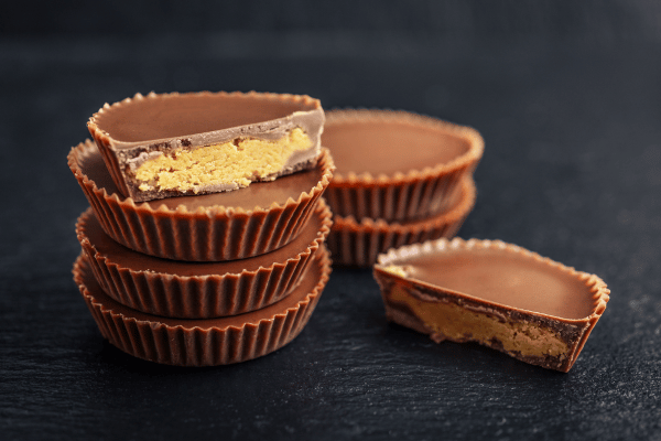 The Ultimate Russel Stover Sugar Free Experience 7 A classic chocolate peanut butter cup, featuring a smooth and creamy peanut butter filling encased in rich chocolate, creating a perfect blend of sweet and nutty flavors.