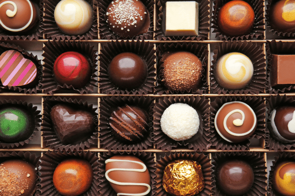 The Ultimate Russel Stover Sugar Free Experience 5 A box filled with an assortment of chocolates, featuring various types and flavors, offering a tempting selection of sweet treats.