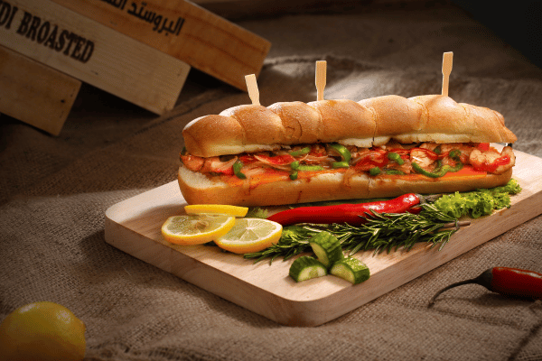 Is Jimmy John's Healthy? Balancing Flavor and Fitness 4 Is Jimmy John's Healthy: A refreshing scene with a sandwich accompanied by vibrant slices of lemons, creating a visually appealing and appetizing composition.