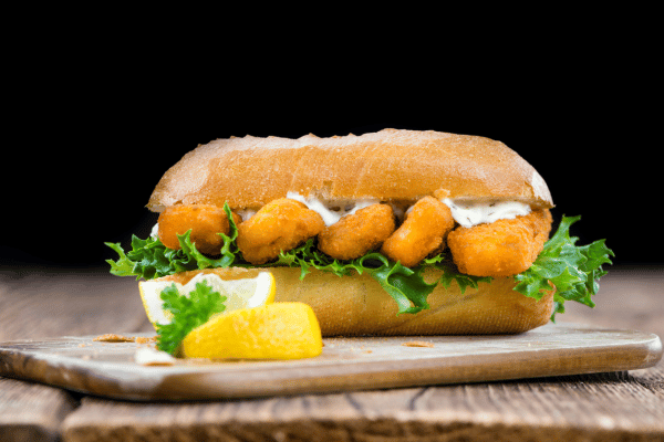 Is Jimmy John's Healthy? Balancing Flavor and Fitness 5 Is Jimmy John's Healthy: A close-up shot of a roll filled with crispy fried fish sticks showcasing this classic seafood snack's golden-brown texture and deliciousness.