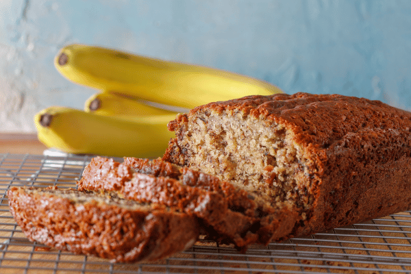 Low Carb Banana Bread: A Guide to a Homemade Goodness 4 Low Carb Banana Bread: Sliced Banana Bread with Fresh Banana on the Side.