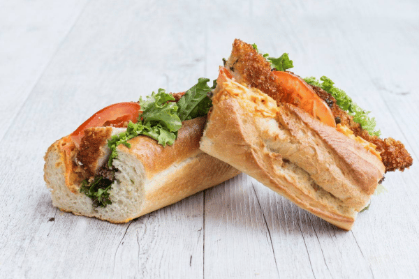 Is Jimmy John's Healthy? Balancing Flavor and Fitness 7 Is Jimmy John's Healthy: A beautifully sliced sandwich, displaying layers of fresh ingredients, creating an appetizing arrangement inviting a delicious bite.