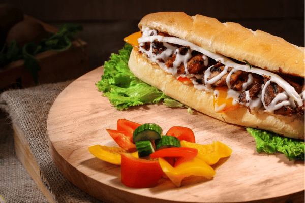 Is Jimmy John's Healthy? Balancing Flavor and Fitness 8 Is Jimmy John's Healthy: A delightful sandwich with pickles and tomatoes on the side, presenting a well-balanced and flavorful combination of ingredients for a satisfying meal.