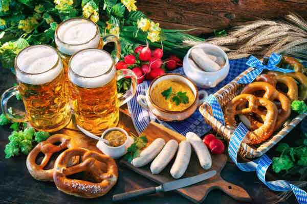 What to Serve with Brats: 10 Irresistible Side Dish Pairings 13 A German feast with sausages, pretzels, radish, and beer