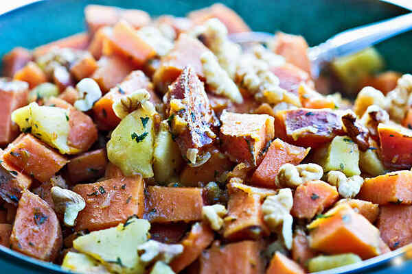 Skillet Sweet Potatoes: A Guide to Mouthwatering Perfection 9 A bowl of sweet potato hash with onions and pepper