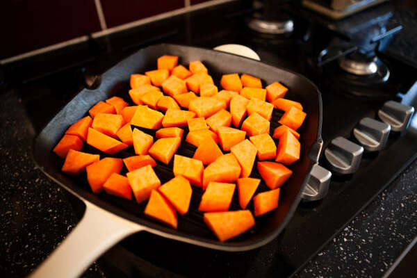 Skillet Sweet Potatoes: A Guide to Mouthwatering Perfection 8 Diced sweet potatoes on a pan