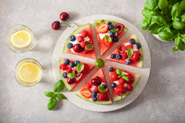 Irresistible Watermelon Pizza: A Sweet Twist on Tradition 7 Watermelon pizza with mixed berries and mint and a side of lemonade