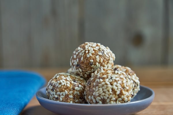 Keto Energy Balls: Energize Your Day With Amazing Recipes! 6 A plate of energy balls covered in sesame seeds