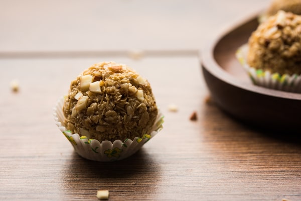 Keto Energy Balls: Energize Your Day With Amazing Recipes! 7 An almond energy ball in a paper cup