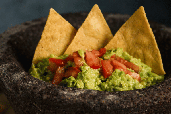 Guacamole with Corn Chips Close-up.