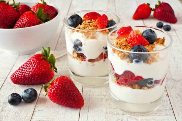 Yogurt parfait with berries in glasses