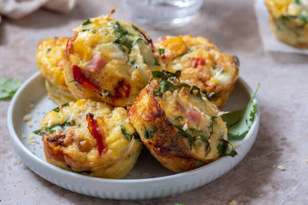 Egg muffins filled with spinach, ham, and cheese