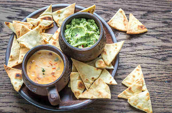 Keto Nachos Recipe: Crunchy Low-Carb Bliss in Every Bite 4 Homemade tortilla chips with guacamole and queso dips