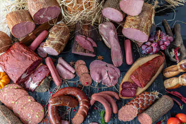Various types of raw processed meats