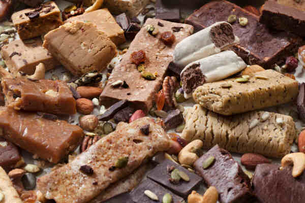 Protein Bars for Weight Loss: Unleash Your Slimming Power 12 A variety of protein bars with chocolate and nuts