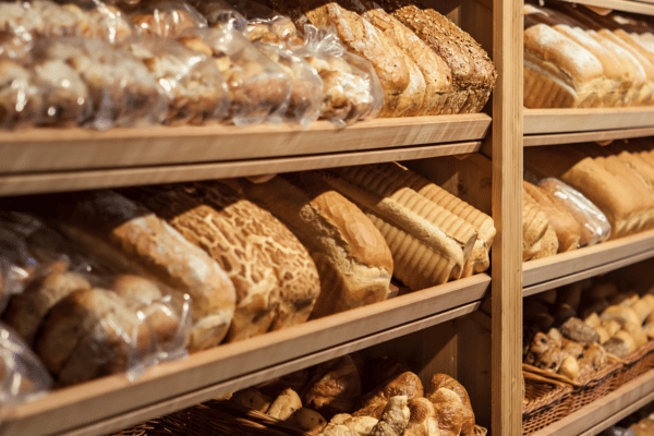 Hero Bread: Unveiling the Secrets of Their Bread 7 A store shelf filled with freshly baked bread.