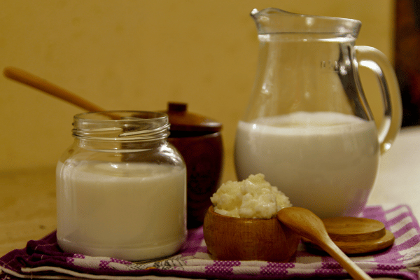 Delicious Kefir Smoothie Recipes to Energize Your Day 9 Homemade milk kefir and kefir grain front view.