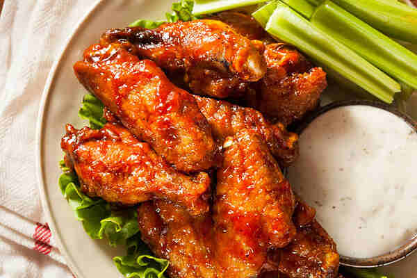 Calories in Chicken Wings: Crack the Code to Smart Snacking 2 Buffalo chicken wings with celery sticks and sour cream dip