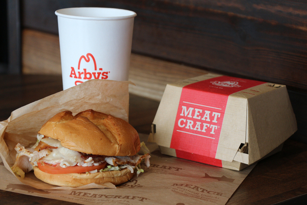 Arby's crispy chicken sandwich with drinks