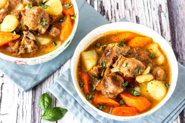Is Lamb Red Meat? Exploring Its Role in a Balanced Diet 8 Bowls of lamb stew with vegetables