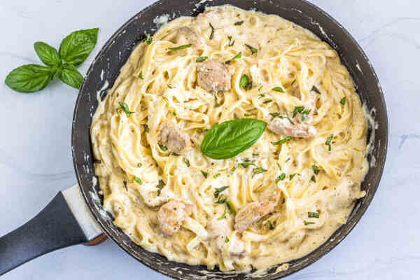 10 Quick Keto Meals for Busy Weeknights 12 Chicken alfredo fettucine with herbs in a pan
