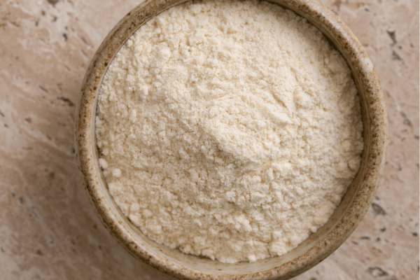 Carbalose Flour: The Ultimate Low-Carb Baking Solution 14 A ceramic bowl filled with fine Carbalose flour.