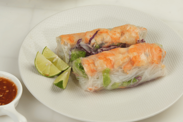 Rice Paper Carbs Explained: What You Need to Know 3 Fresh spring rolls with shrimp in rice paper.