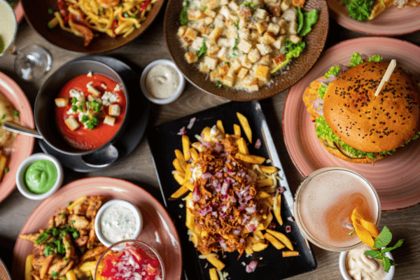 10 Surplus Diet Ideas for a Healthy Lifestyle 3 A Table Full of Delicious Food in Plates Top View.