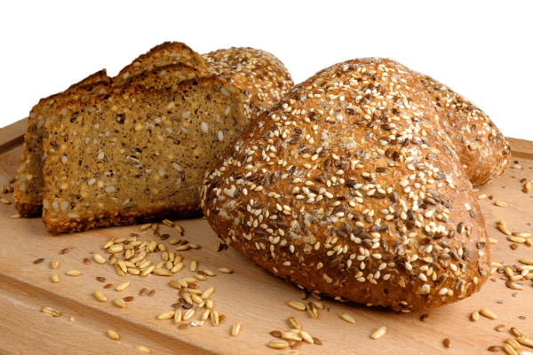 Carbalose Flour: The Ultimate Low-Carb Baking Solution 6 A freshly baked loaf of bread, golden brown and perfectly risen, sits proudly on a wooden table.