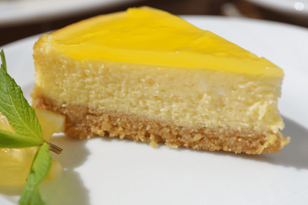 Slice of Lemon Cheesecake on a Plate.