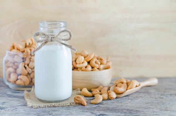 Cashew nuts and cashew milk in a bottle