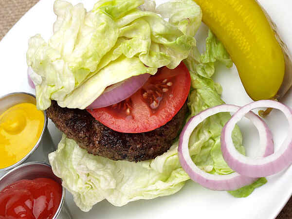 Whataburger Keto: Your Guide to Low-Carb Fast Food Options 7 Lettuce wrapped beef burger with tomato, onion, and pickles