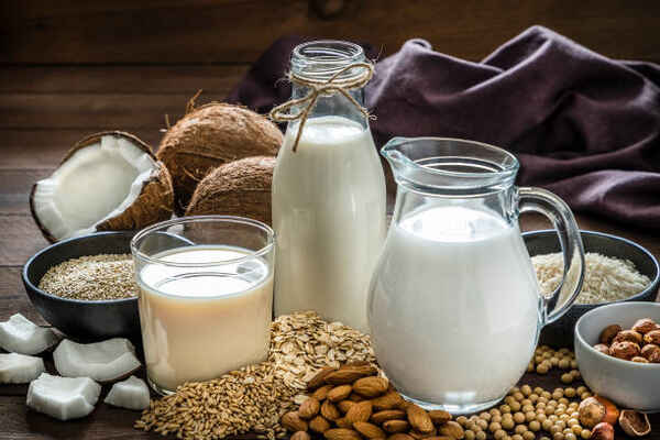 Plant-based milk alternatives in glass containers