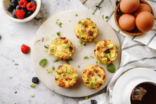 Trader Joe's Cauliflower Thins: Healthy Snack Hacks 9 Avocado and Egg Breakfast Bites on a plate with eggs and avocados on the side.