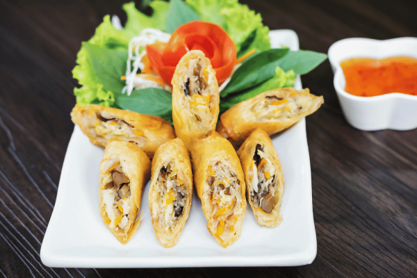 Trader Joe's Cauliflower Thins: Healthy Snack Hacks 10 Turkey and Cheese Roll-Ups cut and beautifully placed on a plate.