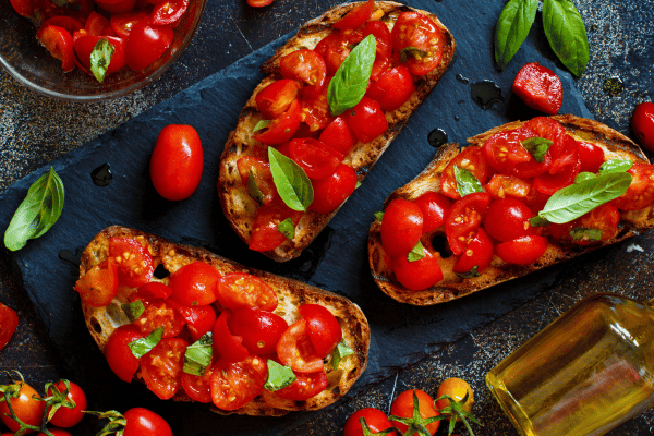 Trader Joe's Cauliflower Thins: Healthy Snack Hacks 13 Tomatoes baked and crisped on top of a veggie bread.