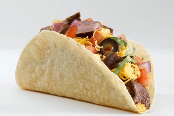 Trader Joe's Cauliflower Thins: Healthy Snack Hacks 3 A taco filled with assorted vegetables, beautifully arranged.