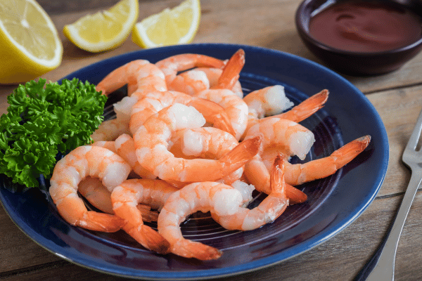 Keto Shrimp Scampi: Quick, Easy, & Low-Carb Recipe 5 Golden, perfectly cooked shrimp on a plate.