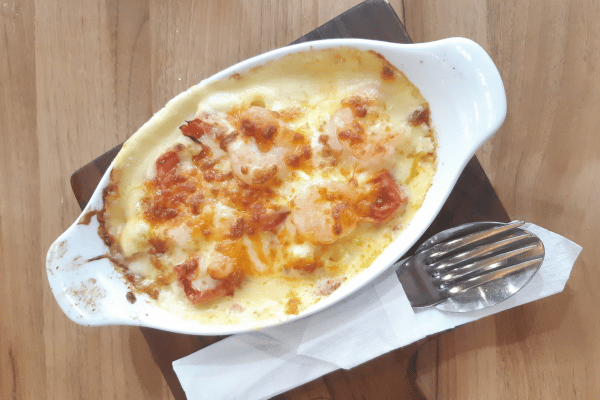 5 Keto Shrimp Recipes: Quick & Easy Dishes You'll Love 8 Keto Shrimp Recipes: Cheese Shrimp on Table.