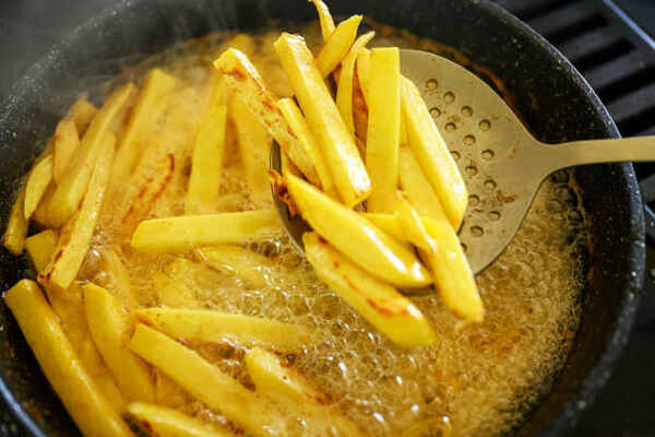 Fried Turnips: A Tasty Twist on a Classic Side Dish 6 Turnips frying in oil in a pan