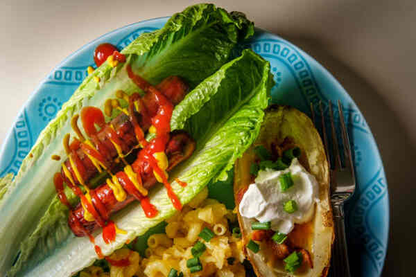 Are Hot Dogs Keto-Friendly? Everything You Need to Know 9 Are hot dogs keto-friendly? Grilled hotdogs with ketchup and mustard in lettuce wraps
