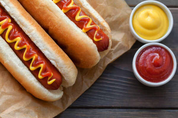 Are Hot Dogs Keto-Friendly? Everything You Need to Know 5 Hot dogs in buns with mustard and ketchup