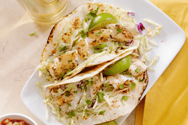 Keto Fish Tacos: The Ultimate Low Carb Recipe and Tips 7 Grilled fish tacos with creamy coleslaw, lime, and fresh cilantro.
