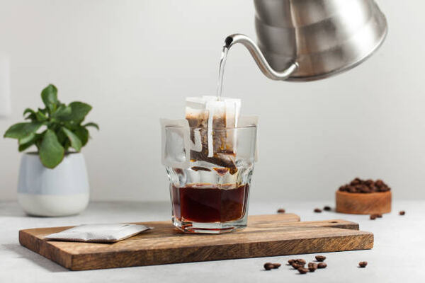 What to Drink During Intermittent Fasting: Hydration Tips 6 Pouring water over drip coffee bag