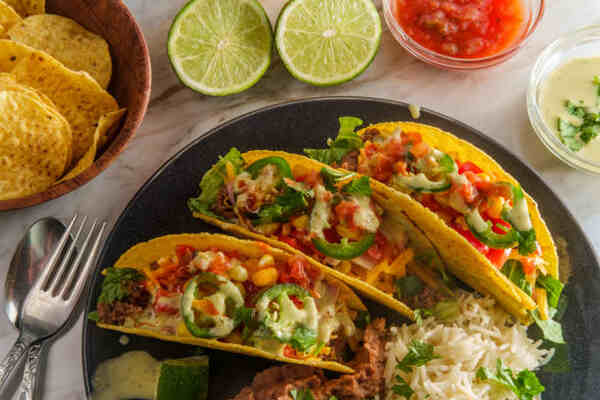 Taco Pie: A Tasty Twist on a Classic Favorite 3 Traditional tacos with beef, vegetables, and cheese fillings