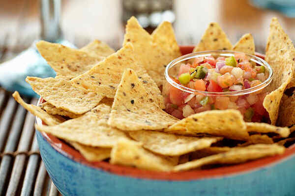 Low-Carb Tortilla Chips to Buy: Top Picks for Dieters 5 Tortilla chips in a bowl served with salsa
