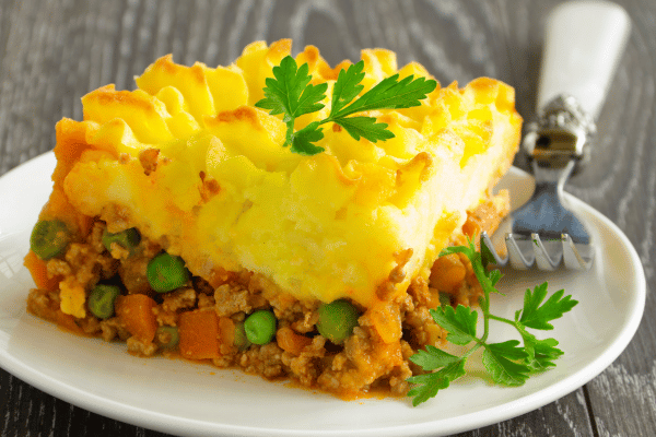Keto Shepherd's Pie Recipe: Quick and Low-Carb Comfort Food 2 A slice of shepherd's pie shows off its tasty layers. On top, there's a golden, crispy mashed potato layer.