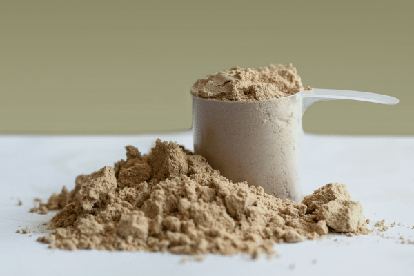 How Low Carb Protein Shakes Can Boost Your Fitness Goals 11 Overflowing with protein shake powder.