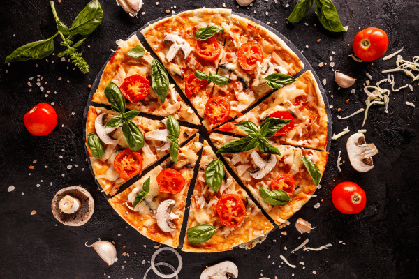 Totino's Pizza Air Fryer Style - Perfectly Crispy and Easy 3 A top view of a perfect pizza loaded with colorful toppings and spices, ready to be enjoyed.