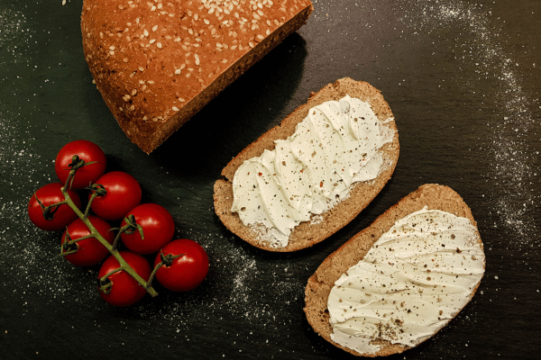 Carb Free Bread Recipe: A Simple Guide for Beginners 3 Two slices of bread, viewed from above, with a smooth, even spread of butter or cream.